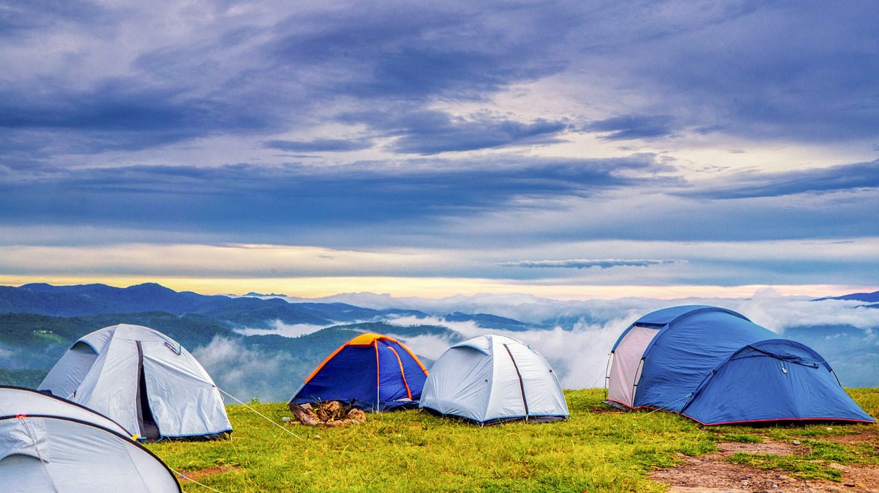 A group of tents on top of a hill.